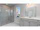 Well-lit bathroom features glass shower, neutral-toned tile, a large mirror, and modern vanity at 715 Choctaw Dr., Conway, SC 29526