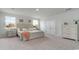 Serene bedroom with large windows, plush carpeting, neutral walls, and coordinated furnishings at 715 Choctaw Dr., Conway, SC 29526