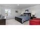 Comfortable bedroom featuring a queen bed, nautical decor, and ample natural light from the window at 715 Choctaw Dr., Conway, SC 29526