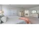 Spacious bedroom with carpet, light gray walls, and a view into the ensuite bathroom at 715 Choctaw Dr., Conway, SC 29526