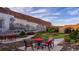 Charming community space with outdoor seating, string lights, and a mural, perfect for gatherings at 715 Choctaw Dr., Conway, SC 29526