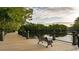 Scenic community view of a wooden walkway with benches overlooking a serene lake and lush greenery at 715 Choctaw Dr., Conway, SC 29526