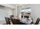 Formal dining room with modern lighting fixture and view to new homes under construction at 715 Choctaw Dr., Conway, SC 29526