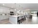 Bright, open kitchen featuring a large island with seating, stainless steel appliances, and white cabinetry at 715 Choctaw Dr., Conway, SC 29526