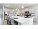 Modern kitchen with stainless appliances, white quartz counters, island seating and pendant lighting at 715 Choctaw Dr., Conway, SC 29526
