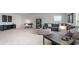 Spacious living room featuring modern furnishings, neutral tones, and a designated workspace area at 715 Choctaw Dr., Conway, SC 29526