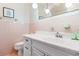 Pink tile bathroom with white vanity and sink at 7152 Highway 134, Conway, SC 29527