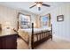 Charming bedroom with a double bed, wooden dresser, and window with curtains at 7152 Highway 134, Conway, SC 29527