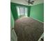 Spacious bedroom with neutral carpeting and a bay window at 803 Sultana Dr., Little River, SC 29566