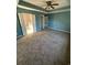 Spacious bedroom with carpet flooring and ceiling fan at 803 Sultana Dr., Little River, SC 29566