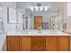 Double vanity bathroom with a large mirror and light wood cabinets at 858 Edgewater Dr., Murrells Inlet, SC 29576