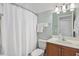 Small bathroom with shower, toilet and wood vanity at 858 Edgewater Dr., Murrells Inlet, SC 29576