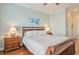 Main bedroom with wood sleigh bed, nightstands, and hardwood floors at 858 Edgewater Dr., Murrells Inlet, SC 29576