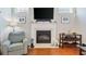 Living room fireplace with a white mantel at 858 Edgewater Dr., Murrells Inlet, SC 29576