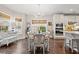 Bright dining area with hardwood floors and a white farmhouse table at 860 Villarosa Dr., Myrtle Beach, SC 29572