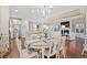 Open dining room with hardwood floors and view into the living area at 860 Villarosa Dr., Myrtle Beach, SC 29572