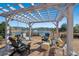 Peaceful pergola overlooking a lake with seating area at 860 Villarosa Dr., Myrtle Beach, SC 29572