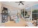 Relaxing screened porch with seating area and ceiling fan at 860 Villarosa Dr., Myrtle Beach, SC 29572