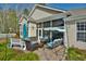 A cozy screened-in porch with comfortable seating, ideal for enjoying the outdoors while relaxing and entertaining at 905 Adaline Ct., Myrtle Beach, SC 29579