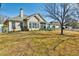 A spacious backyard with a lush green lawn and a screened-in porch with patio furniture, perfect for outdoor relaxation at 905 Adaline Ct., Myrtle Beach, SC 29579