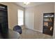 Neutral bedroom with lots of natural light features a large closet, desk, and additional shelving at 905 Adaline Ct., Myrtle Beach, SC 29579