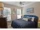 Cozy bedroom features a blue bed frame and coastal decor, creating a relaxing space at 905 Adaline Ct., Myrtle Beach, SC 29579