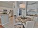 Bright eat-in kitchen featuring white cabinetry, stainless steel appliances and a tile floor at 905 Adaline Ct., Myrtle Beach, SC 29579