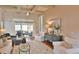 Bright and airy living room featuring vaulted ceilings, neutral decor, plush seating, and sliding doors to the screened-in porch at 905 Adaline Ct., Myrtle Beach, SC 29579