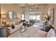 Bright and airy living room featuring vaulted ceilings, neutral decor, plush seating, and sliding doors to the screened-in porch at 905 Adaline Ct., Myrtle Beach, SC 29579