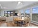 Dining area with wood table and chairs, overlooking the view at 9661 Shore Dr. # C-14, Myrtle Beach, SC 29572