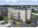 Exterior view of the building with a pool and parking at 9661 Shore Dr. # C-14, Myrtle Beach, SC 29572