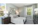 Serene bedroom with a queen-size bed, neutral decor and large windows at 114 Ranch Haven Dr., Murrells Inlet, SC 29576