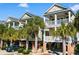 Three two-story homes with brick driveways and palm trees at 116B 15Th Ave. N, Surfside Beach, SC 29575