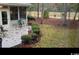 Private patio with seating area, surrounded by mature trees at 1218 Spinnaker Dr., North Myrtle Beach, SC 29582