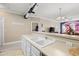 Kitchen features double sink, white cabinets, and view to living room at 131 Waypoint Ridge Ave. # Q13, Little River, SC 29566