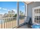 Relaxing screened balcony with lake view and seating area at 131 Waypoint Ridge Ave. # Q13, Little River, SC 29566