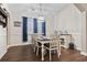 Bright dining room with hardwood floors and chandelier at 1400 Rainsbrook Ct., Conway, SC 29526