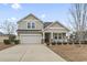 Two-story house with a large yard and a two-car garage at 1400 Rainsbrook Ct., Conway, SC 29526