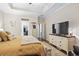 Main bedroom with large TV and dresser at 1400 Rainsbrook Ct., Conway, SC 29526