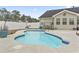 Relaxing kidney-shaped pool in backyard oasis at 1400 Rainsbrook Ct., Conway, SC 29526