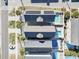 Aerial view showcasing two houses with solar panels and private pools at 1514-A S Ocean Blvd., Surfside Beach, SC 29575