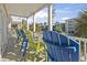 Inviting balcony featuring vibrant Adirondack chairs offering neighborhood views in a tranquil setting at 1514-A S Ocean Blvd., Surfside Beach, SC 29575