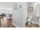Convenient half bathroom with a pedestal sink, perfect for guests with nearby Gathering room at 1514-A S Ocean Blvd., Surfside Beach, SC 29575