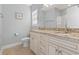 Bathroom with granite countertop, double sinks, and toilet at 1514-A S Ocean Blvd., Surfside Beach, SC 29575