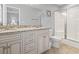 Bathroom with granite countertop, double sinks, and shower at 1514-A S Ocean Blvd., Surfside Beach, SC 29575