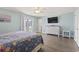 Main bedroom with king bed, dresser, and access to balcony at 1514-A S Ocean Blvd., Surfside Beach, SC 29575