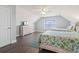 Bright bedroom features two beds, hardwood floors, neutral walls, and a ceiling fan at 1514-A S Ocean Blvd., Surfside Beach, SC 29575