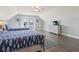 Bedroom featuring twin beds, wood-look floors, and access to the balcony at 1514-A S Ocean Blvd., Surfside Beach, SC 29575