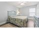 Cozy bedroom with a seashell-themed bed frame and matching dresser, offering a beachy feel at 1514-A S Ocean Blvd., Surfside Beach, SC 29575