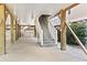 Spacious carport with support beams and stairs leading up to the house at 1514-A S Ocean Blvd., Surfside Beach, SC 29575